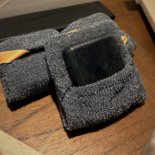 XI.11 Carbone bamboo charcoal bar soap in its included grey exfoliating pouch